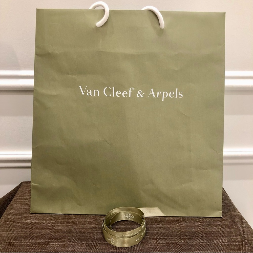 Authentic Van Cleef & Arpels gift bag with original ribbon. Very good condition.